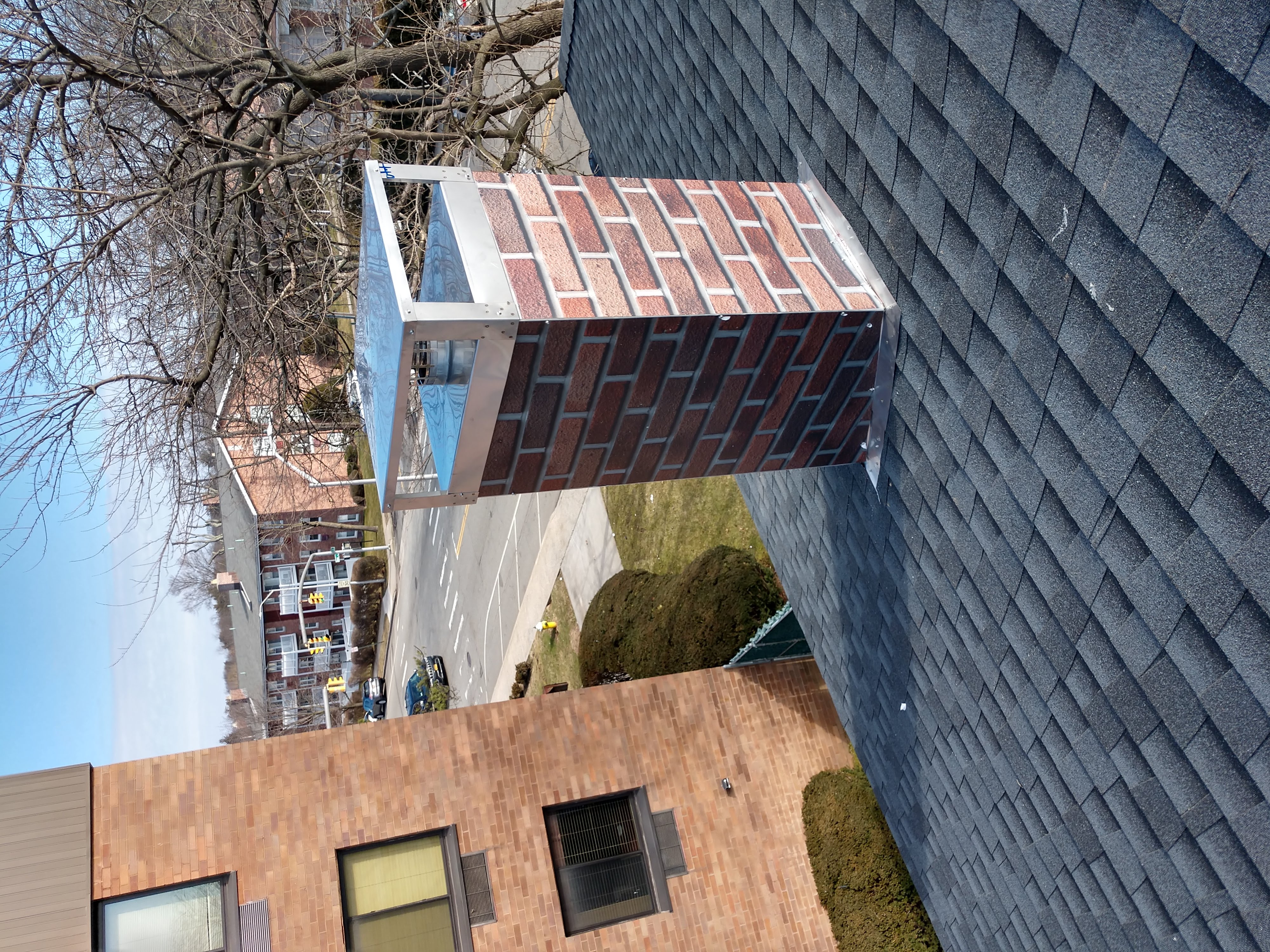 New elastomeric sealant applied to chimney crown in Hampton Bays, NY