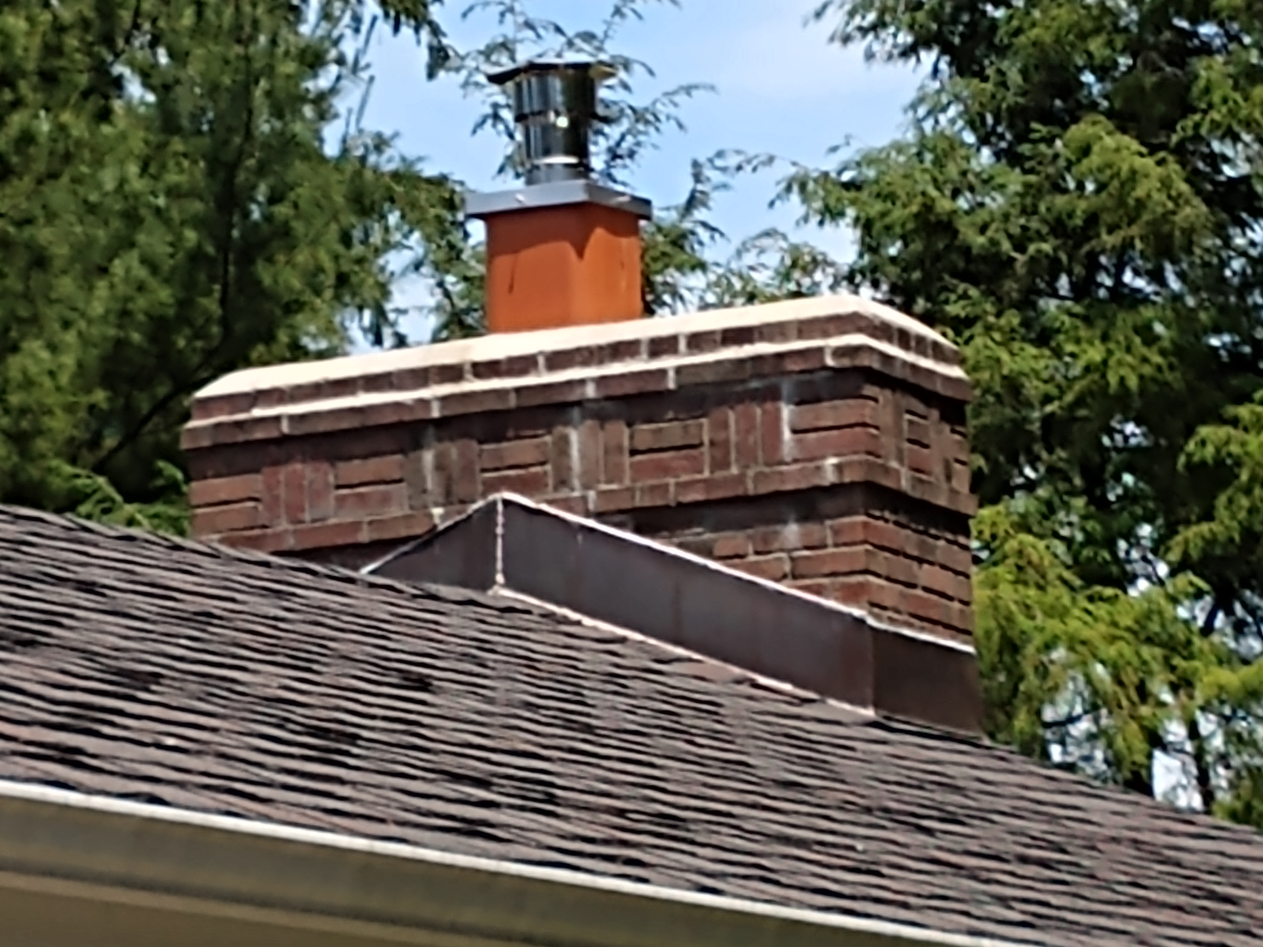 Stainless steel chimney cap with animal guard in Hampton Bays, New York